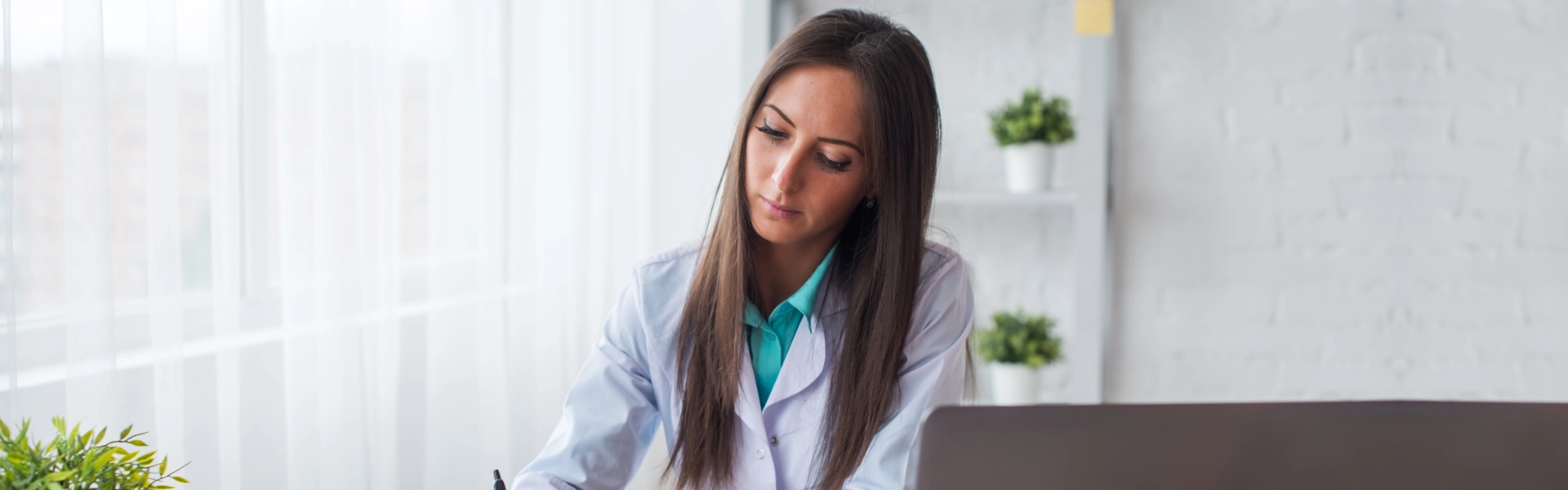 A female nurse writting a promissory note