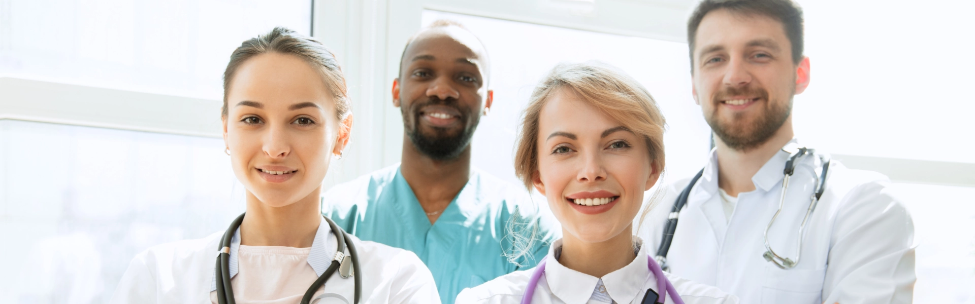 Four medical staffs smiling