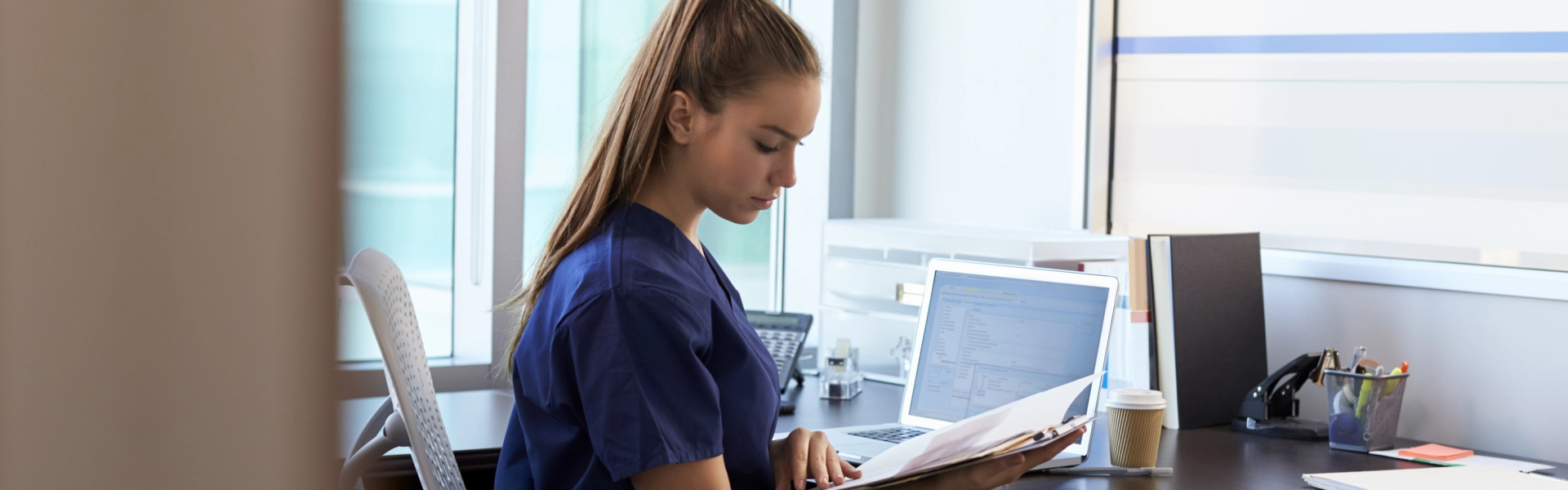 A female nurse reading